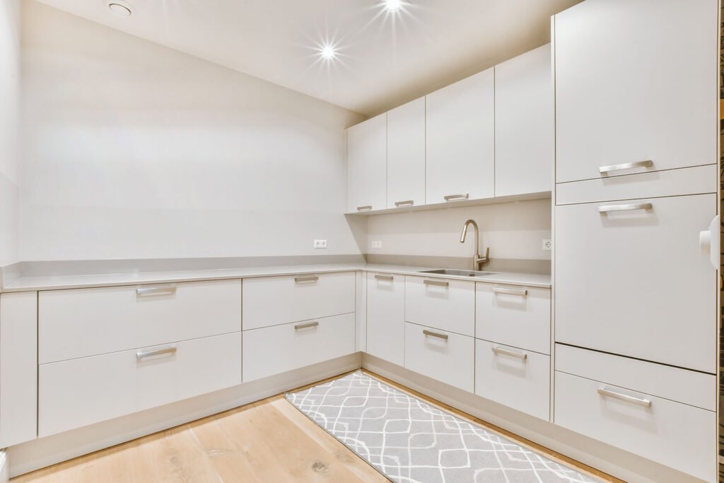 Modern modular kitchen in white with crome handels 