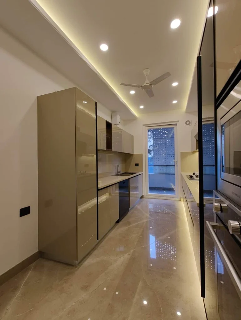 A Modular kitchen with lights and fan and sparkle touch